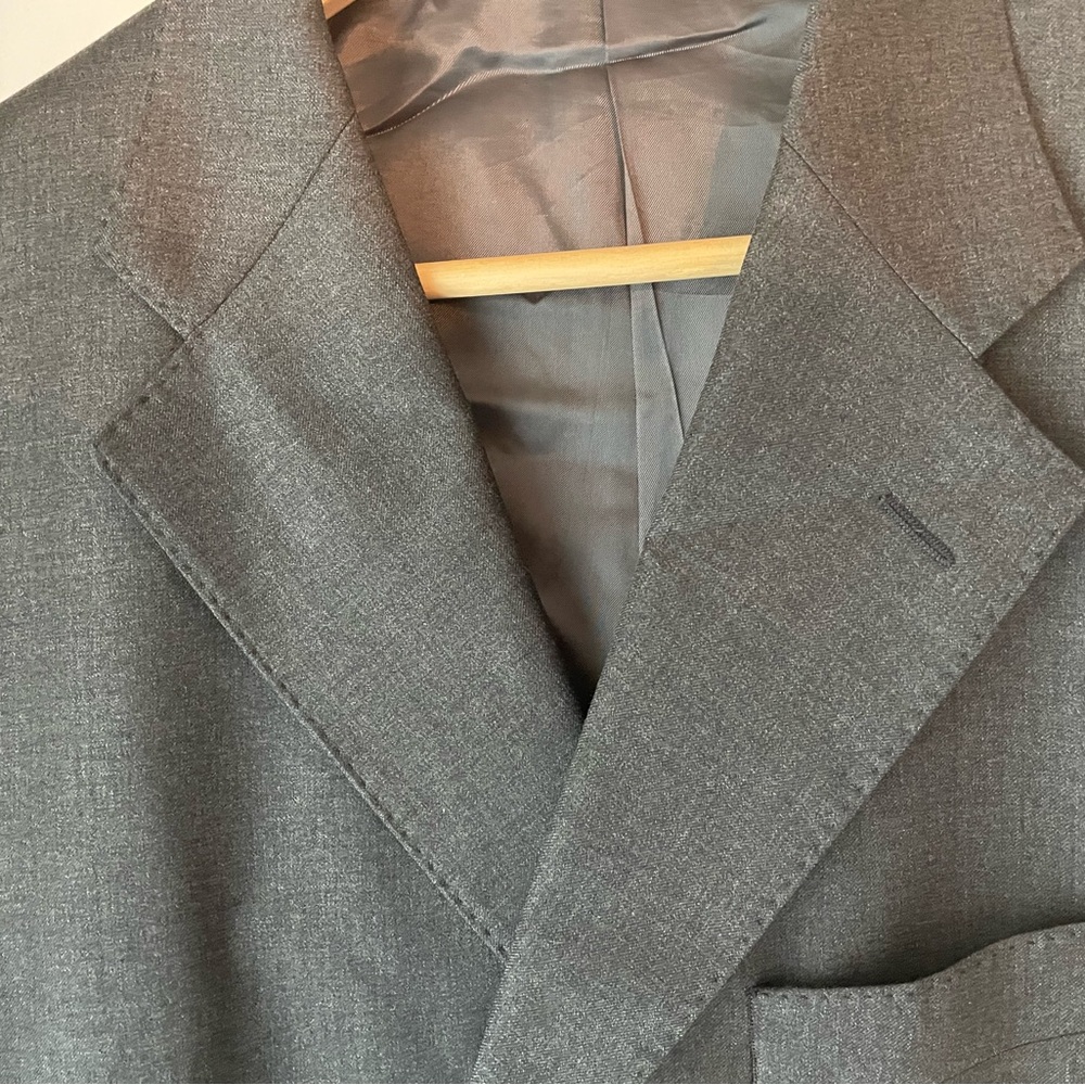 Hand-made Italian suit and is made from virgin wool rayon and cupro